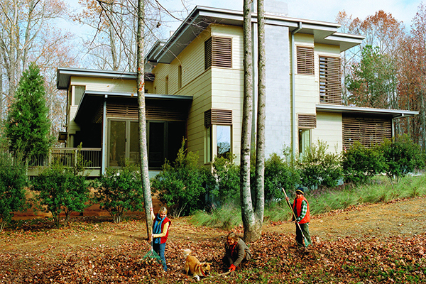 Contemporary-House-In-James-Hardie-Fiber-Cement-Siding-With-Family-Raking-Leaves