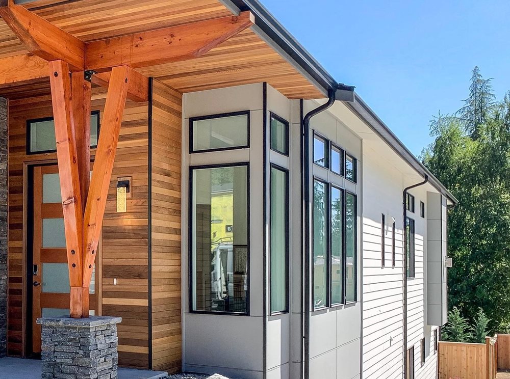 modern style featuring plank siding and wood accents