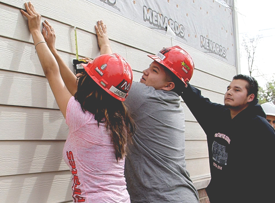 Students-Securing-HardiePlank-Fiber-Cement-Lap-Siding-Over-House-Wrap